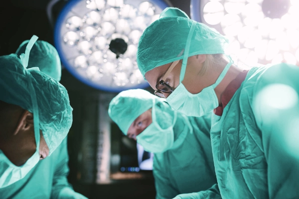 Healthcare professionals in operating theatre